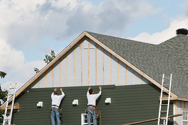 Professional Storm Damage Siding Repair technician working in Lake Alfred, FL